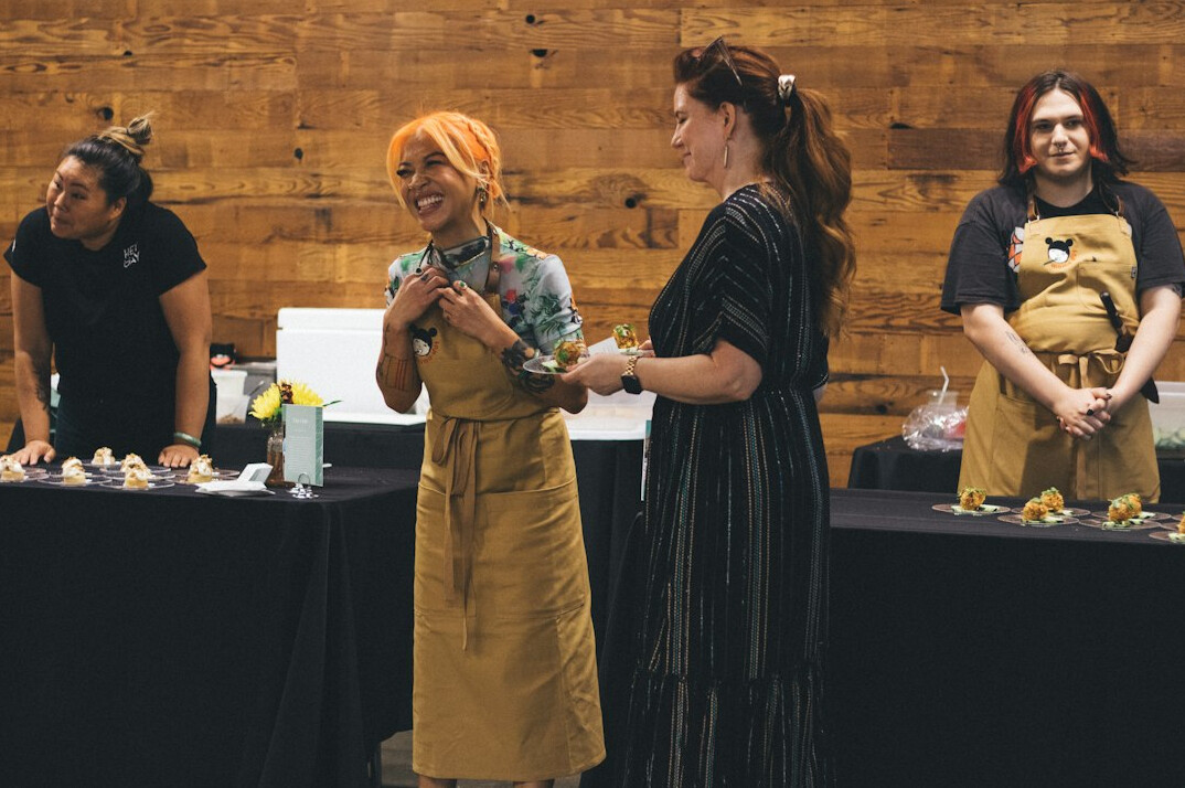Diverse group of professionals discussing around a table during a workshop